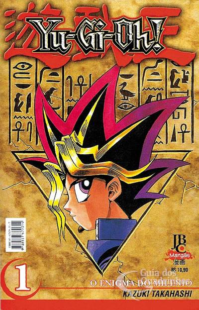 Capa da primeira edição brasileira do mangá Yu-Gi-Oh!. 
A capa tem um aspecto que se assemelha a um papiro, parece papel envelhecido. Na parte superior lemos o nome do manga, em caixa-alta, com letras brancas e fundo vermelho e vários hieróglifos ao fundo. No meio, temos um triângulo invertido, no qual o perfil do personagem principal se encaixa: vemos o rosto de perfil, com uma gola azul, cabelos com detalhes dourados e, na parte superior, detalhes vermelhos e roxos. 
À esquerda, na parte inferior, tem o número 1 em branco, com contorno vermelho, e, do lado direito, inferior, tem a logo da editora, JBC MANGÁS, e o nome do autor em negrito. 
O personagem que tá na capa se chama Yūgi Mutō.
